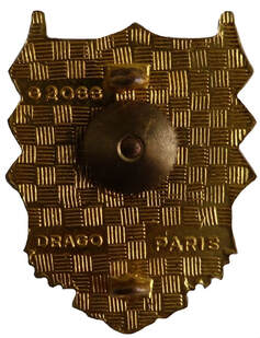 Dos insigne GALAT n° 14 DRAGO, hélice et étoile en relief. Dos guilloché, plat et doré, avec monture deux anneaux. Homologation en haut à gauche Alat.fr