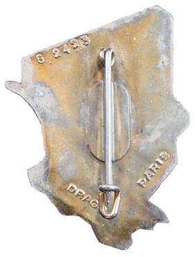 Dos de l'insigne DETALAT Tchad type 2 : DRAGO, dos lisse, plat et doré, avec monture boléro à une pastille rectangulaire aux coins arrondis Alat.fr