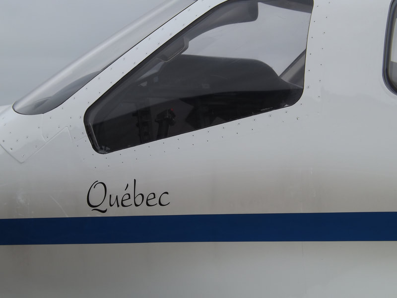 Inscription Québec sur le TBM 700 n° 115/ABQ Alat.fr